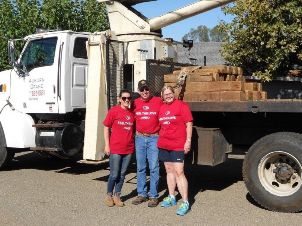 Ashley, Mickey and Mary in front of a crane